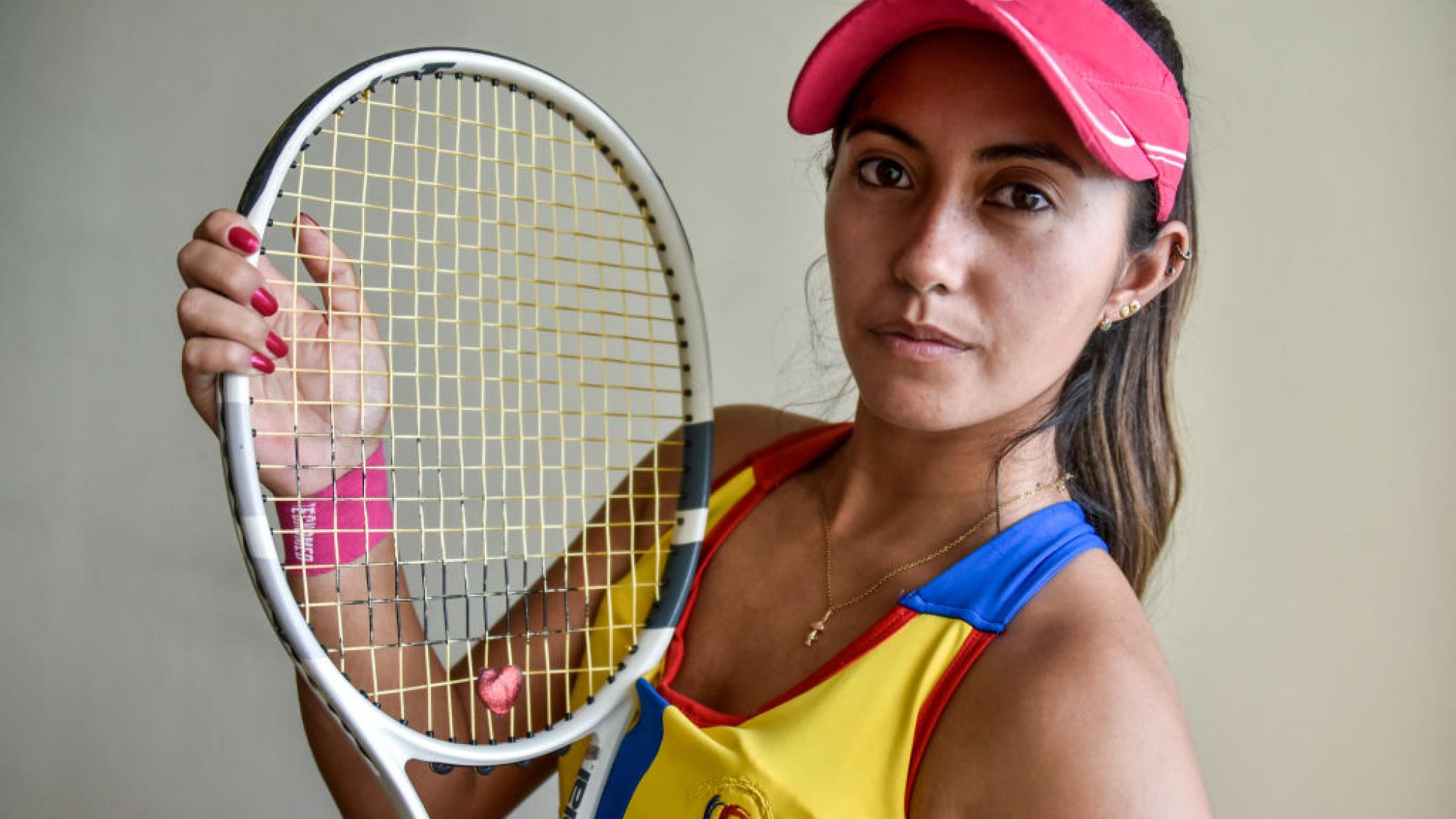 Angelica Bernal of Colombia poses for a photo with her racquet.