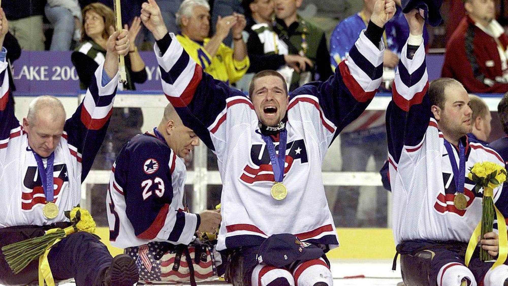 USA Para ice hockey players react on the ice after receiving their medals