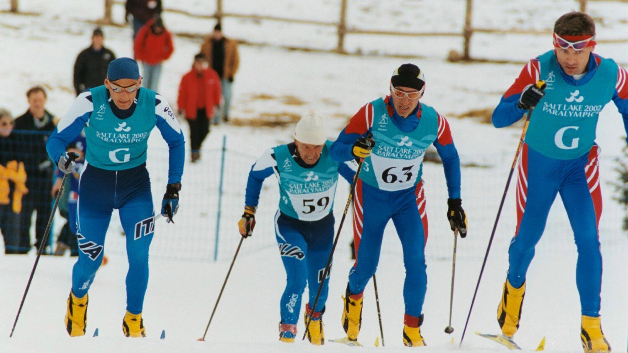 These skiers make their way up the hill during the Men's B2 Short Distance at Soldier Hollow