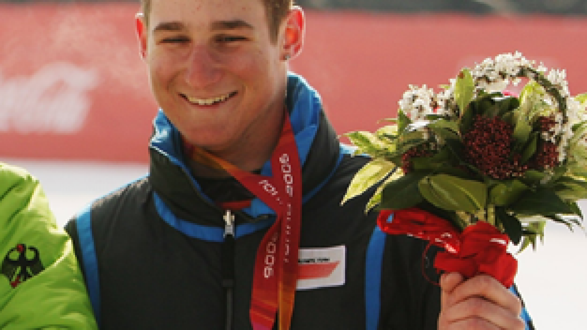 A picture of a man showing his bronze medal