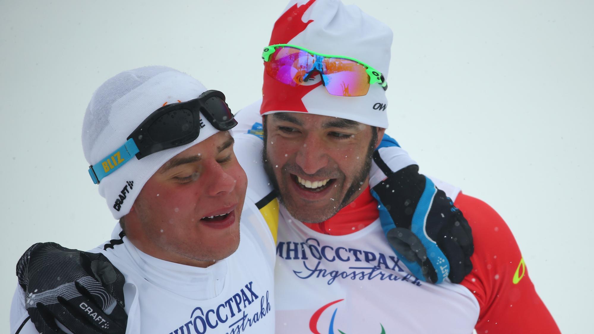 Two athletes embrace each other for a close-up photo.