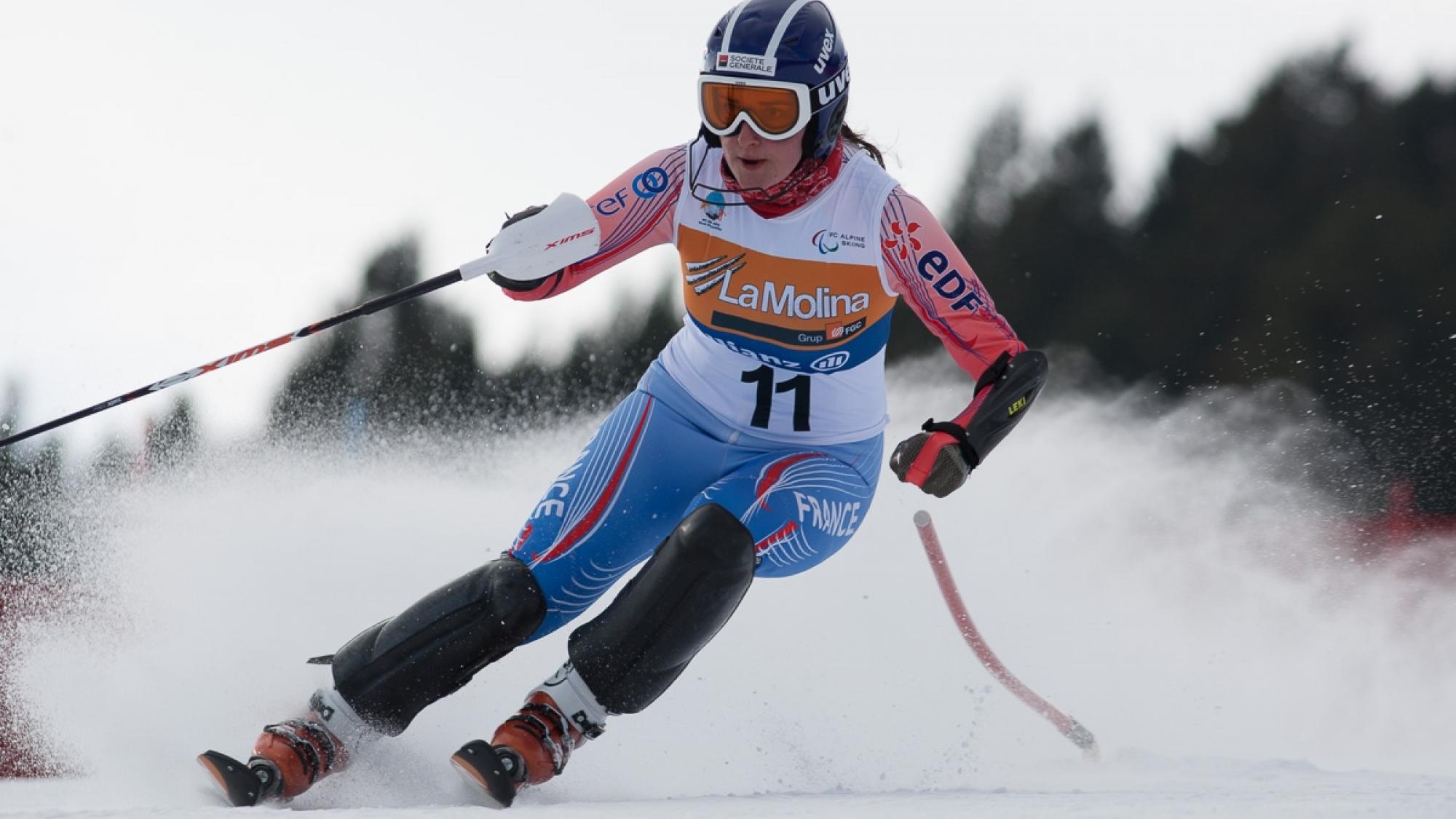 A picture of a woman skiing on the slopes