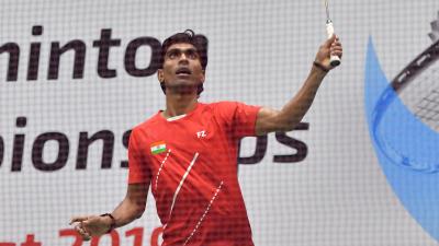 India badminton player looks up prepared to return a shot