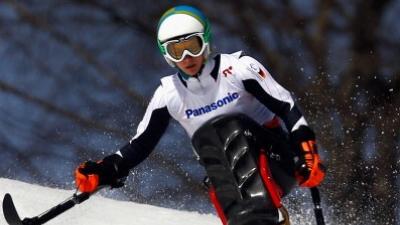 Athlete practicing alpine skiing in a sit-ski.