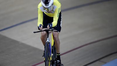 A male Para cyclist going round the track