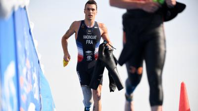 male Para triathle Alexis Hanquinquant sprints towards the finish line