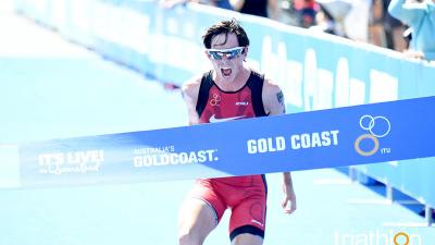 Para triathlete celebrates when crossing the line