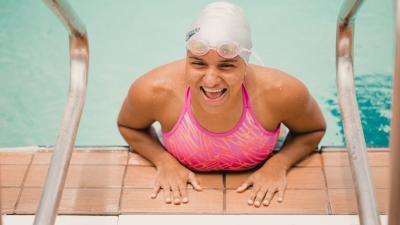 Alejandra Aybar smiling by the pool