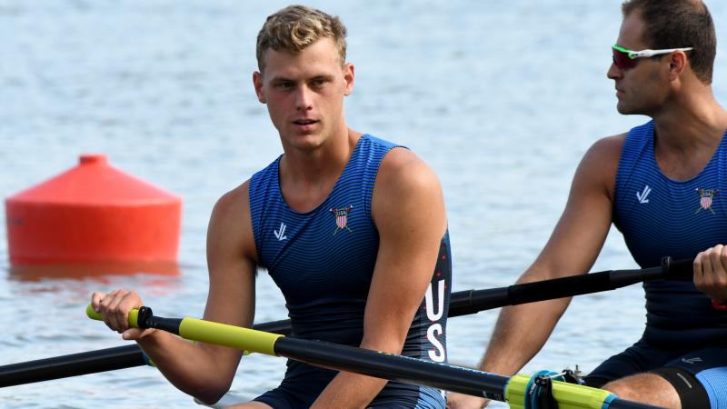 Man sits in rowing boat