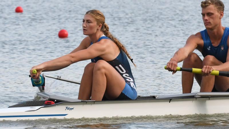 Woman in rowing boat strokes