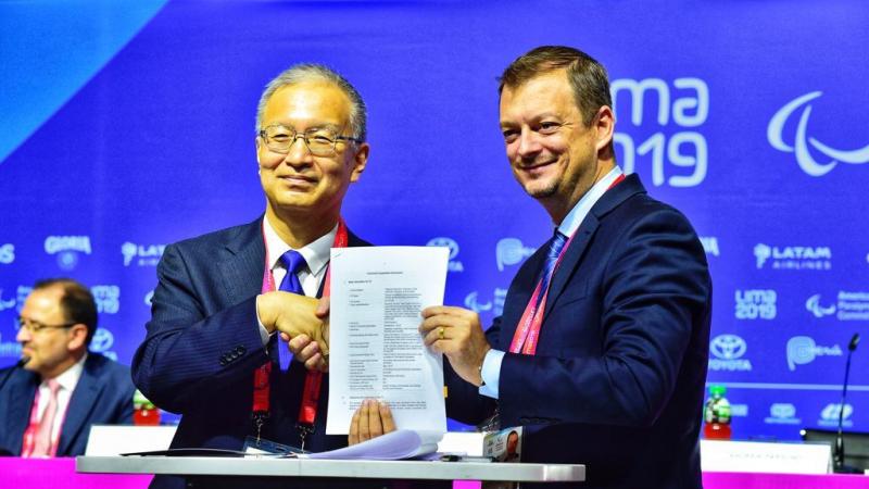 IDB Executive Director for Japan Toshiyuki Yasui and IPC President Andrew Parsons pose for picture after signing new agreement for En sus marcas, listos... Inclusion