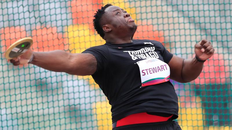 a male Para athlete throws a discus