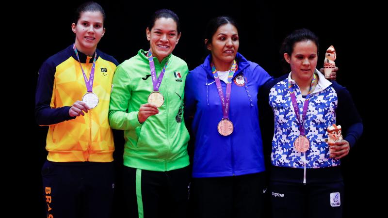 four female judokas on the podium