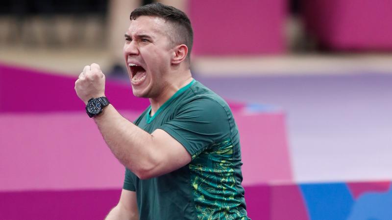 a male Para table tennis player celebrates