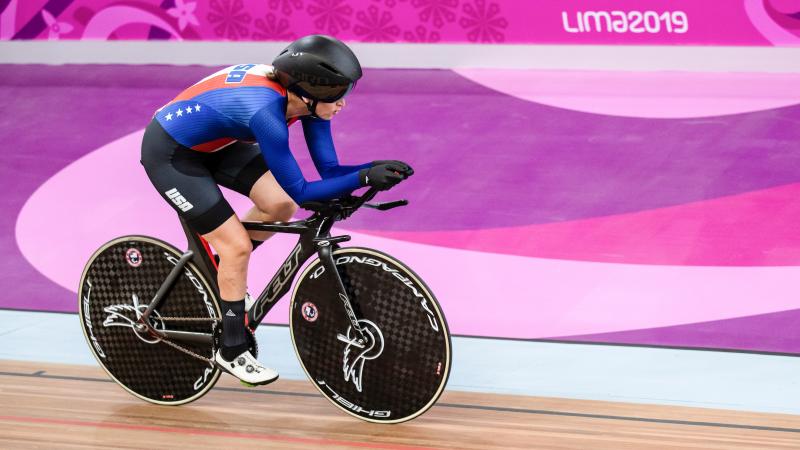 a female Para cyclist on the track 