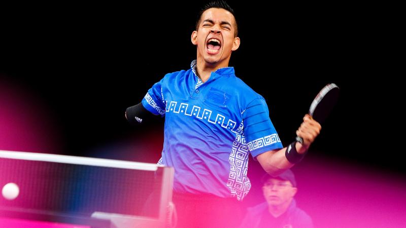 a male Para table tennis player celebrates