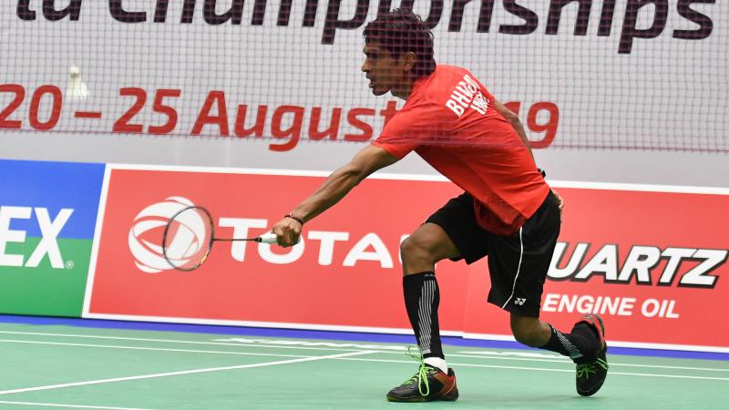 Indian badminton player lunches for a shot