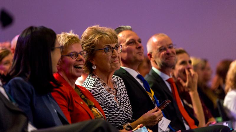 Group of audience members laughing