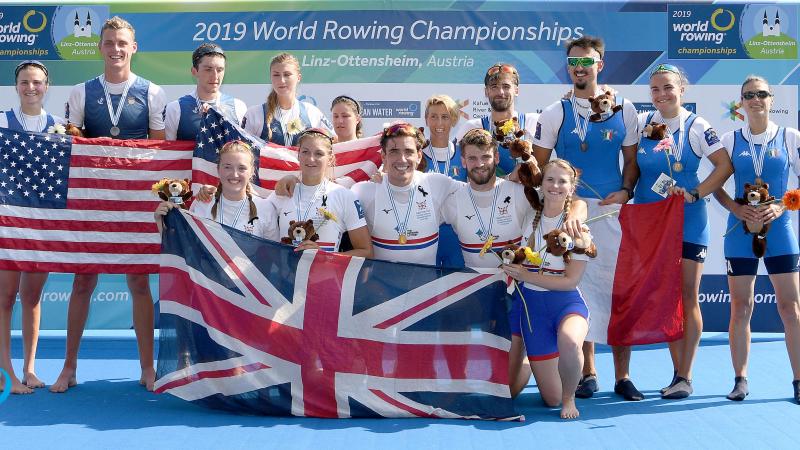 Podium shot of all three medallists of the PR3 Mix4+ crew