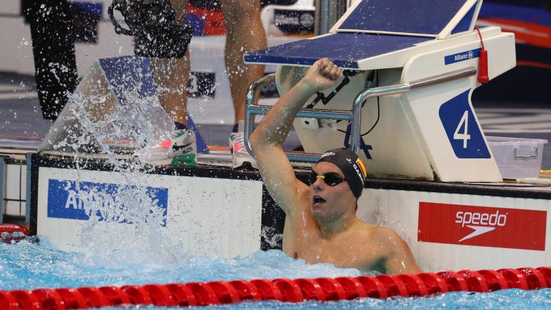 Man celebrates in pool