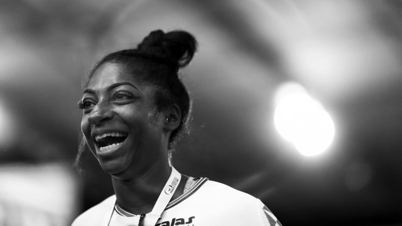 a female Para cyclist smiling