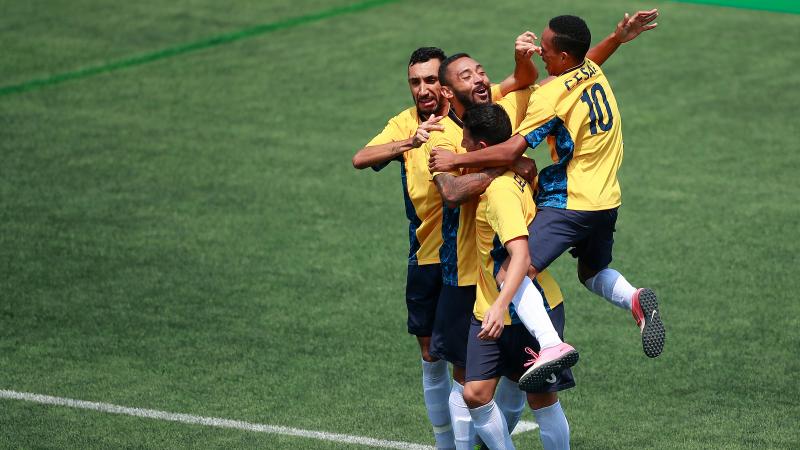 male football 7 players celebrate a goal 