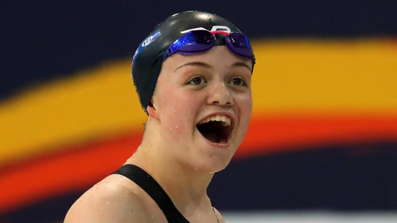 a female Para swimmer smiling