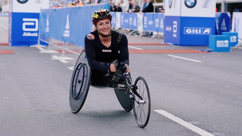 A female wheelchair racer on the streets of Berlin