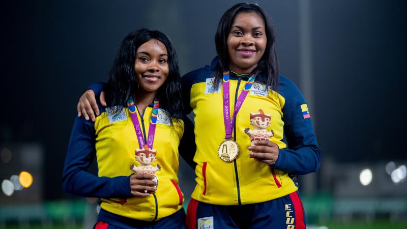 Ecuadorian Poleth Mendes stands on the podium with the gold medal hanging around her neck