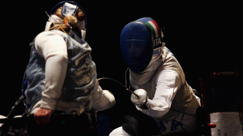 Two women fencing