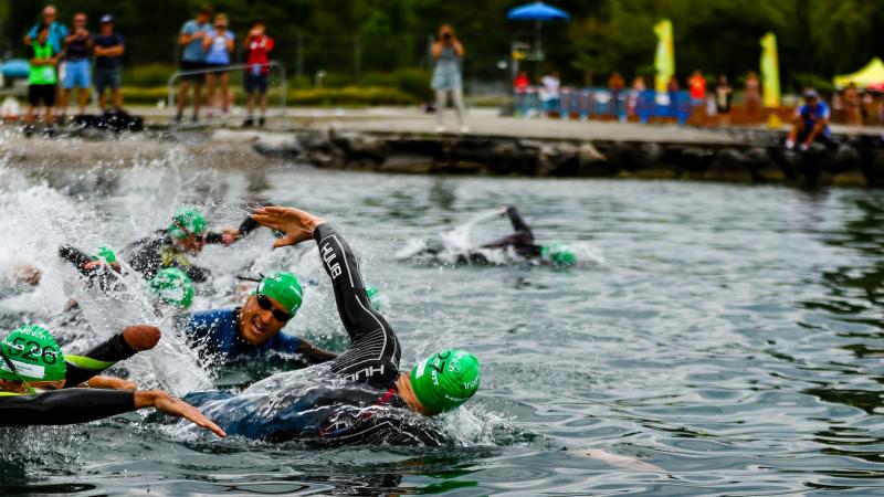 Triathletes swimming in open water