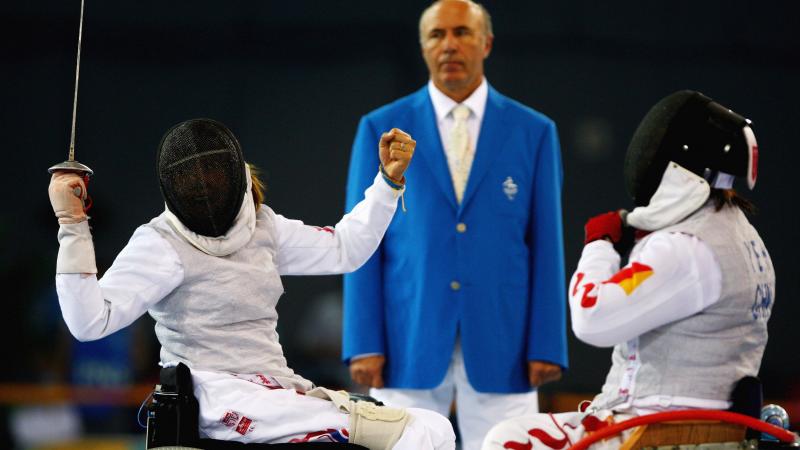 Woman celebrates winning in wheelchair fencing