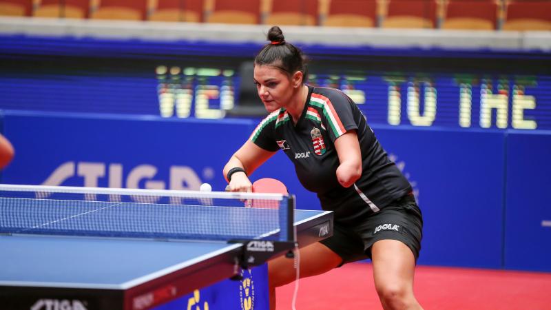Hungarian table tennis player with left arm amputation returns a shot