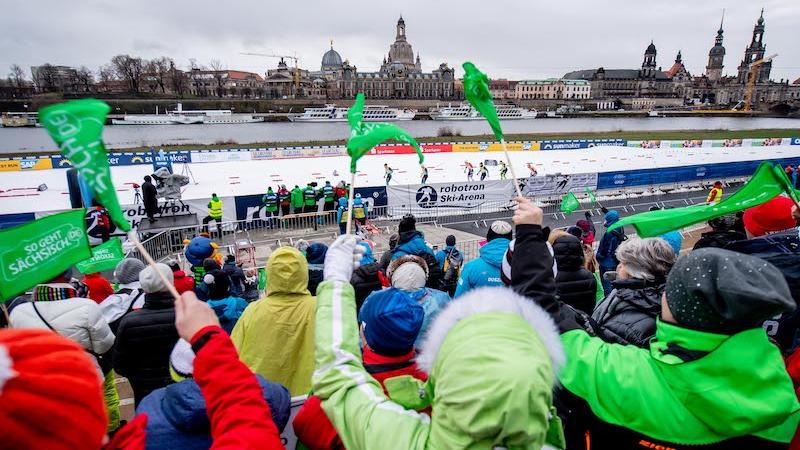 A group of fans watching a cross-country skiing competition in the centre of Dresden
