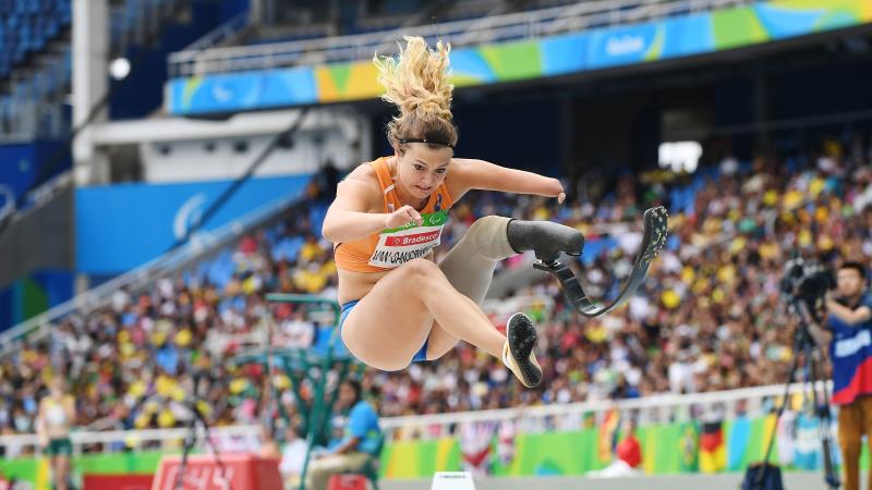 A female Para athlete competing in the long jump