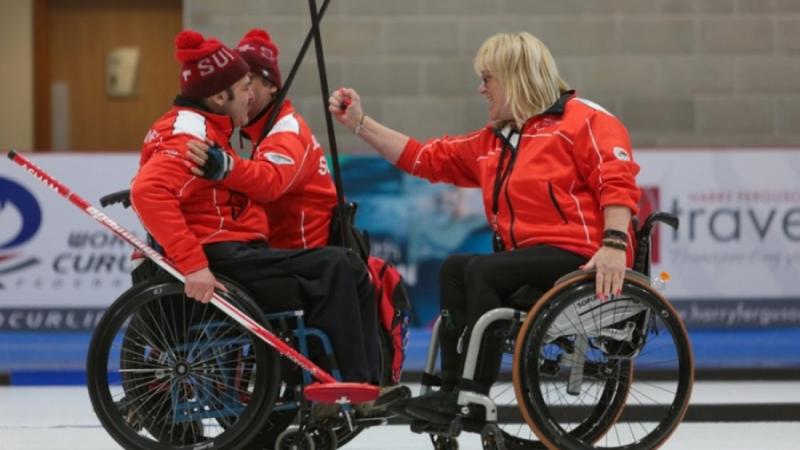 JUBILANT ALL: Hans Burgener, Francoise Jaquerod and Eric Decorvet celebrate Switzerland's win at Stirling 2019