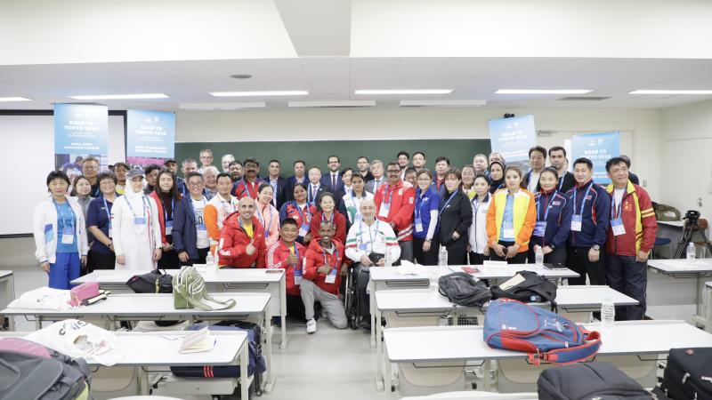 42 Participants of the Road to Tokyo 2020 workshop and educators pose for a picture in a classroom at Tsukuba University