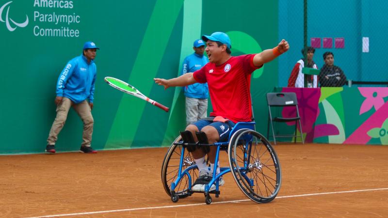 Alexander Cataldo celebrates on the court after winning