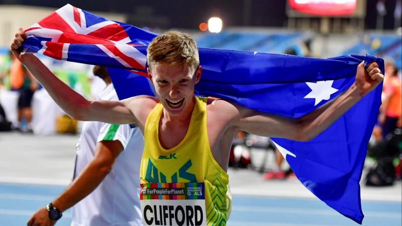Jaryd Clifford  celebrates with Australian flag