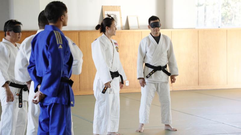 Judokas standing on the tatami