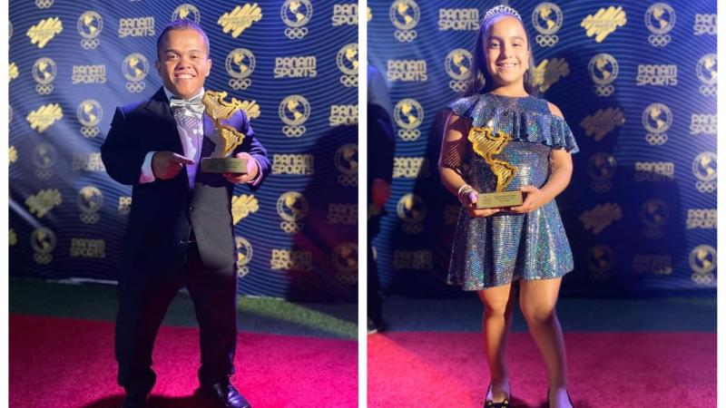 Herbert Aceituno and Sara Vargas hold their trophies