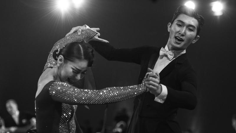 Korean woman in wheelchair and her standing male partner dance in combi standard