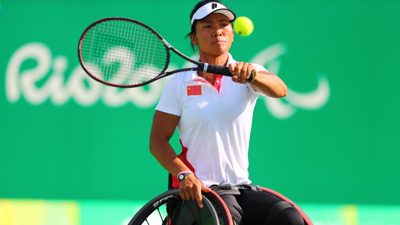 Chinese wheelchair tennis player Zhenzhen Zhu hitting a forehand