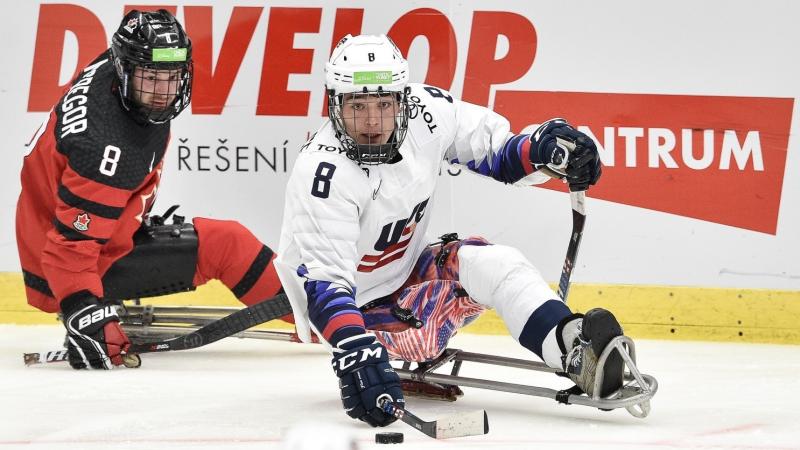 Two Para ice hockey players on the ice