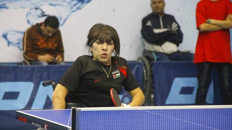 Jordanian female table tennis player celebrates