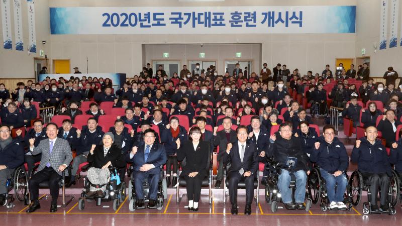 Group photo of athletes and staff at an initiation ceremony of a training centre