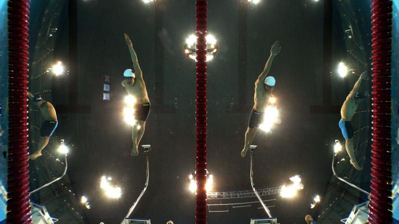 Underwater shot of men competing in swimming