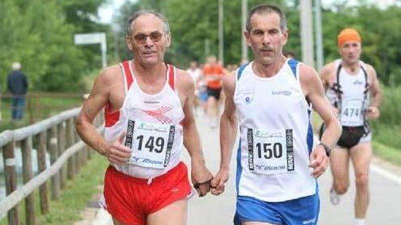 Blind marathon runner with his guide