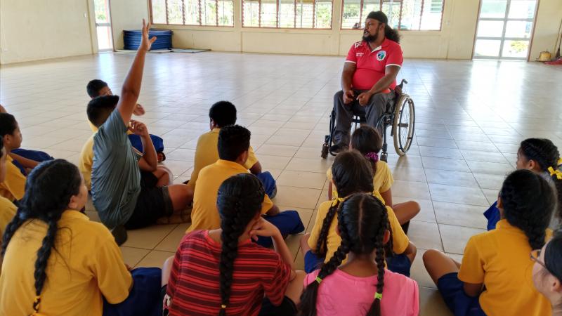 Siaosi Vaka of Tonga discussing inclusion with school children