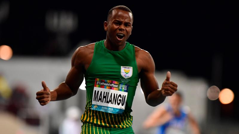 A male runner celebrating